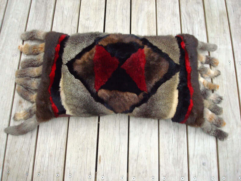 Big possum fur Arabian Nights pillow or cushion cover in ottoman size with tassels and geometric colored pattern