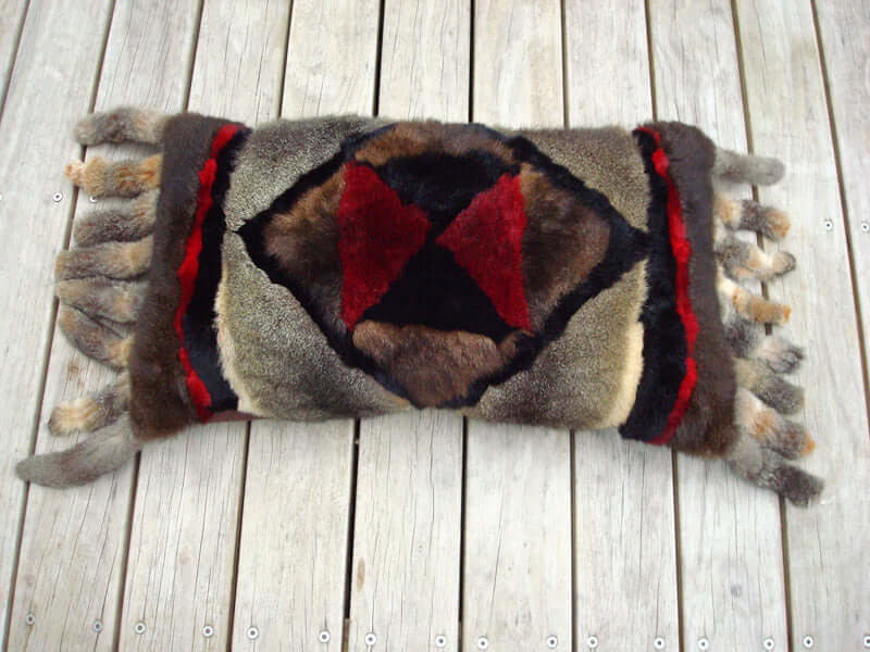 Big possum fur Arabian Nights pillow or cushion cover in ottoman size with tassels and geometric colored pattern