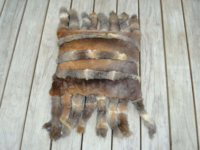 Possum fur camel saddle cushion pillow ottoman with tassels in shorn opossum inspired by Saudi Arabian culture