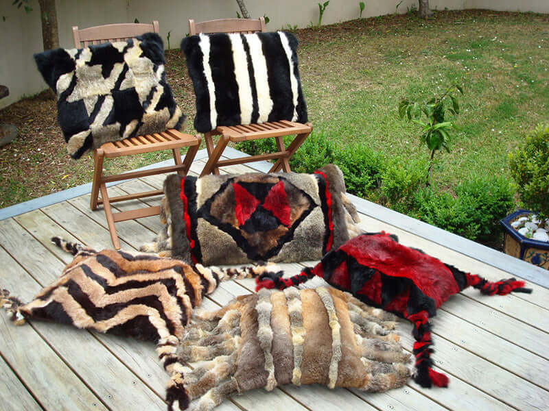 Possum fur camel saddle cushion pillow ottoman with tassels in shorn opossum inspired by Saudi Arabian culture