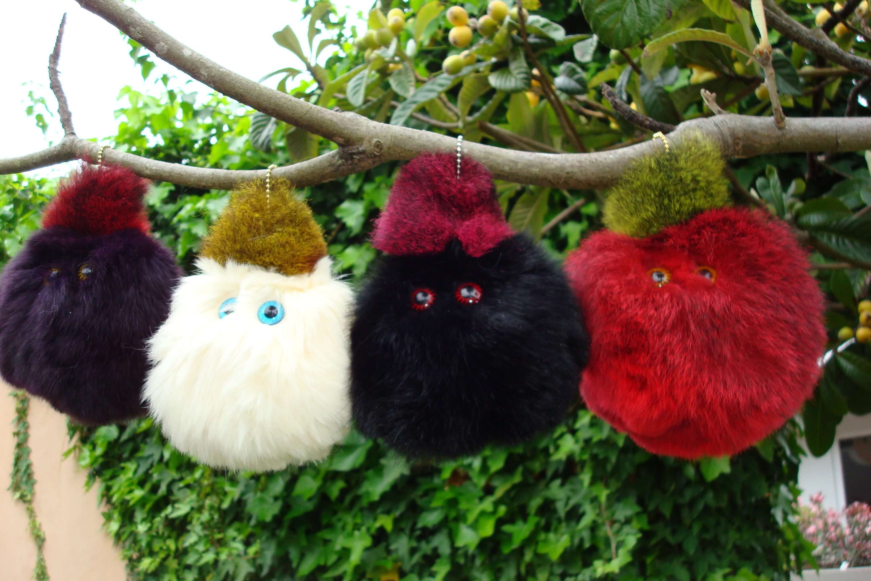Possum fur ball toy for kids that squeaks when squeezed to hang on tree, car aerial or schoolbag