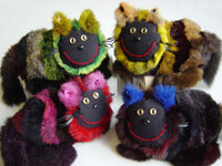 Possycat toy in colored possum fur stripes and manic smile with passport. Great NZ gift for cat lovers